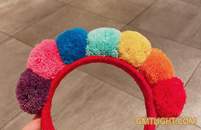 headband with various colors of hair ball