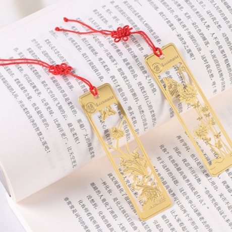 Brass hollowed out bookmark of plum, orchid, bamboo and chrysanthemum style